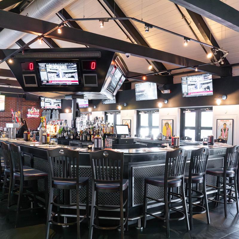 The center bar at Lester's surrounded by televisions tuned to sports